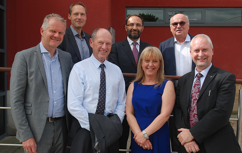 Delegates from the Paracelsus Medical University are pictured with Huddersfield's Professor Karen Ousey, Professor Andrew Ball (far right) and Professor Ojan Assadian (centre rear)