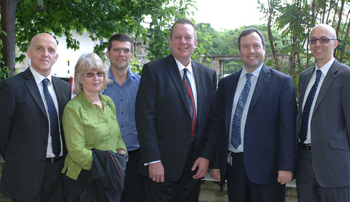 Tom Doyle with staff from the University of Huddersfield