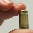 University of Huddersfield researcher holding bullet