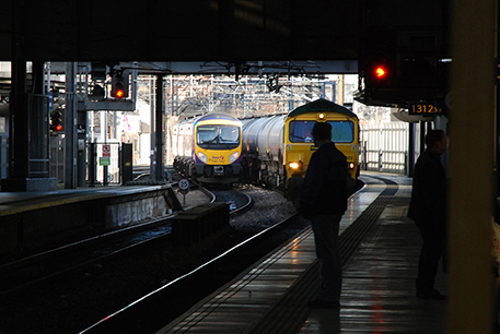 trains pulling into platform