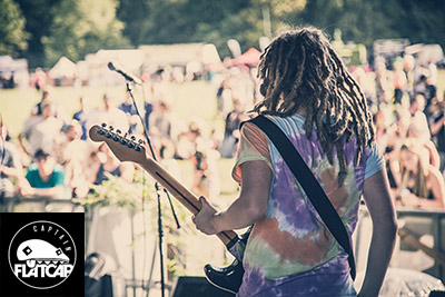 Tom Rotherham playing on a festival stage in Melbourne