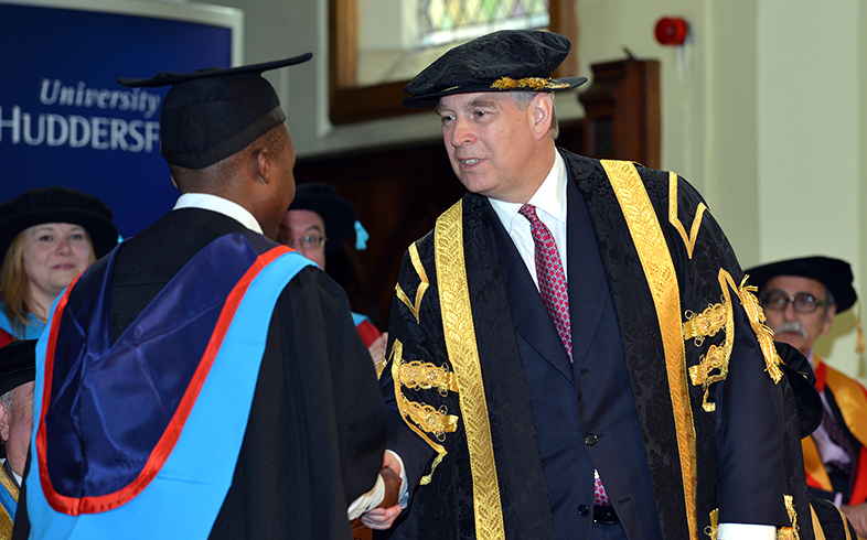 The Duke of York shakes hands with student