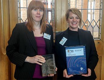 Conference organiser Dr Gemma Sweeney with Dr Lindsay Harding collecting the School of Applied Science’s Bronze Athena Swan certificate and trophy