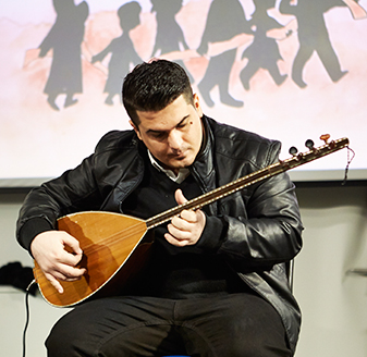 Kurdish musician Halweft playing the saz